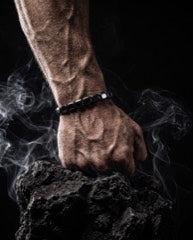 Fist clenched on a rock